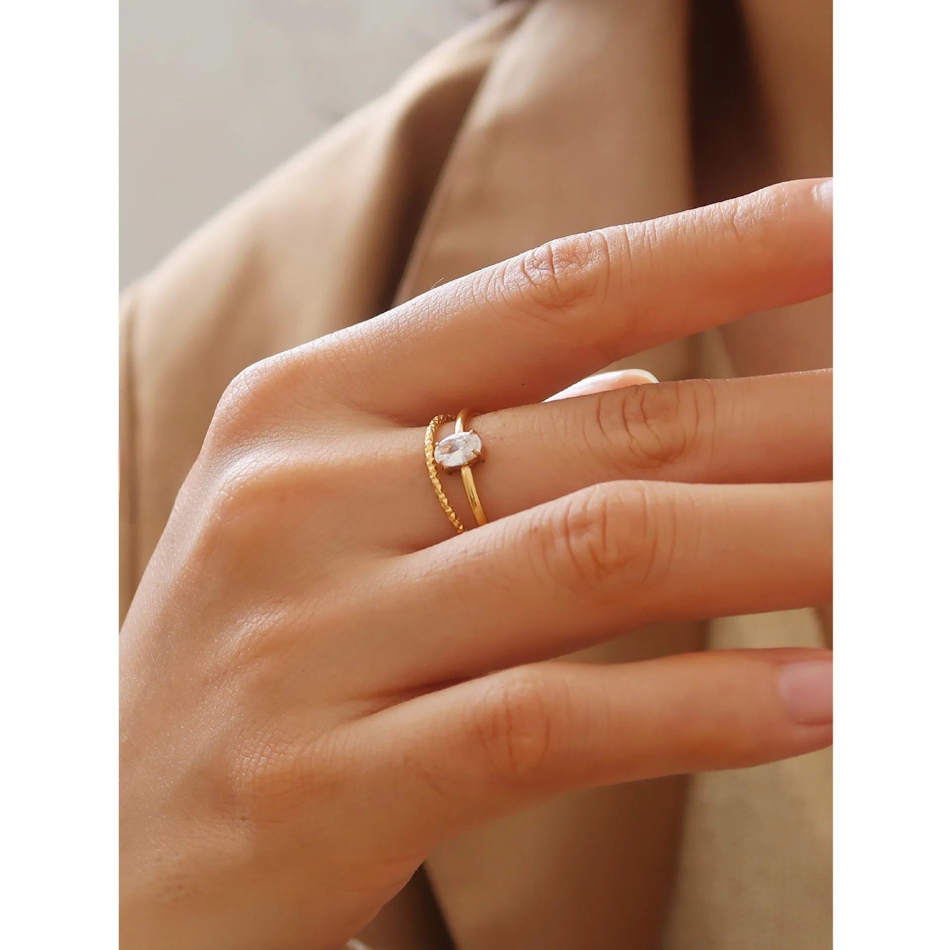 Golden stainless steel love heart ring with an oval ring bath design.