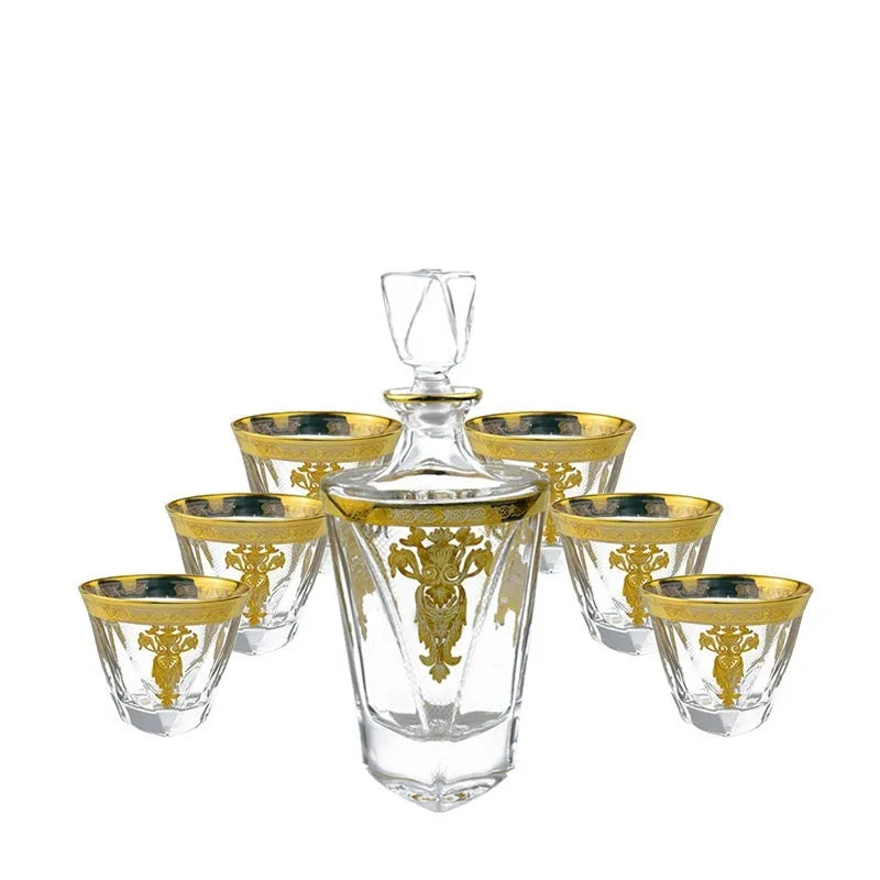 Crystal glass whisky tumbler set with gold line detailing, Nordic style, one wine bottle and six glasses on table