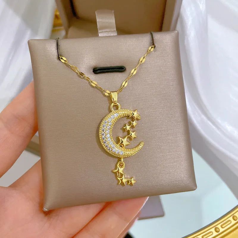 Geometric full moon pendant necklace with crystal setting and tassel on a stainless steel chain.
