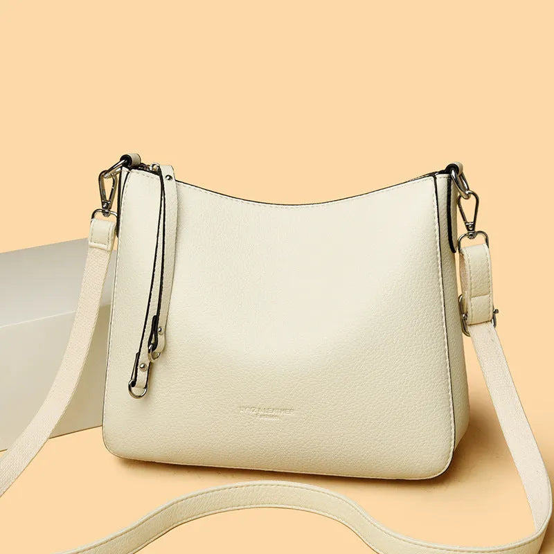Genuine leather crossbody bag with metal belt decoration, horizontal square shape, available in khaki and other colours