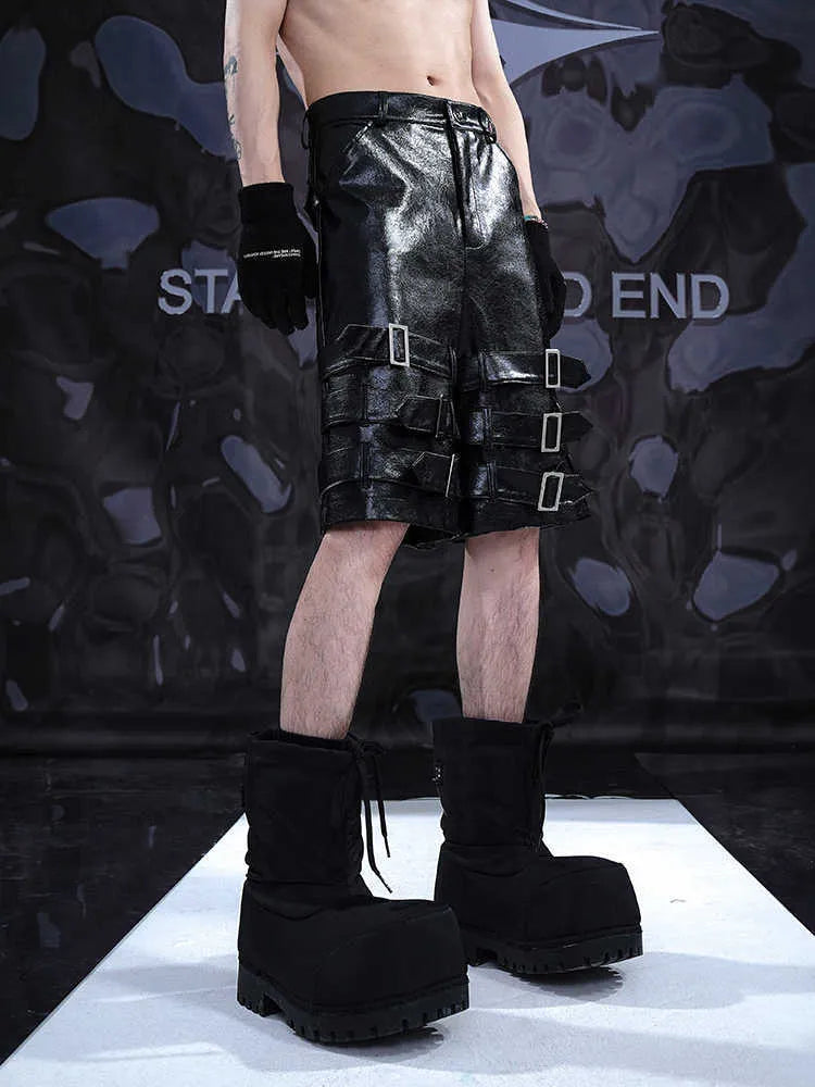 Men's black PU leather cropped pants with distinctive ring detailing and stretch fabric