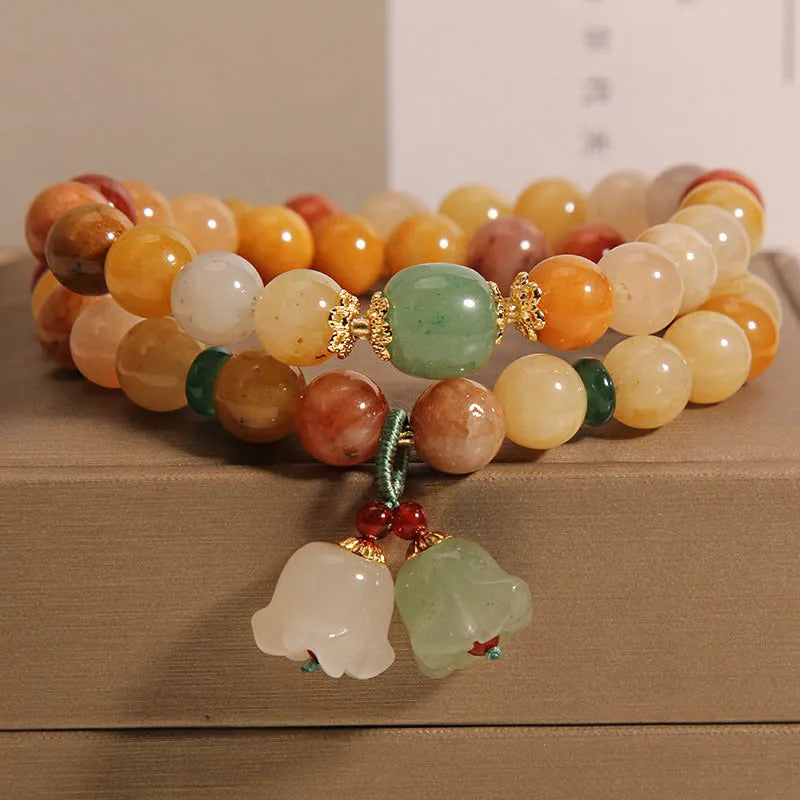 Natural Jinsi Jade multi-layer women's bracelet with adjustable cord tie closure and orchid pendant