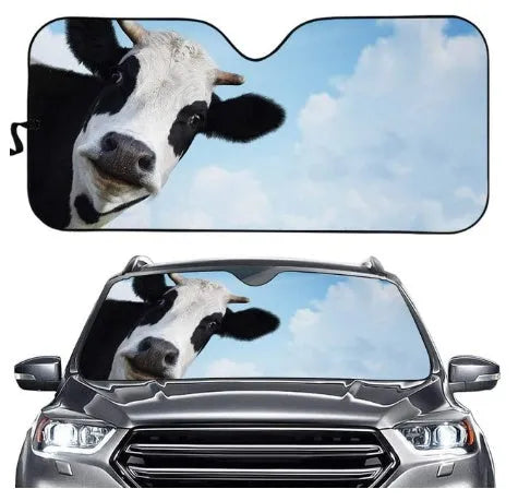 Aluminium foil telescopic car sun shield extended across a car windscreen