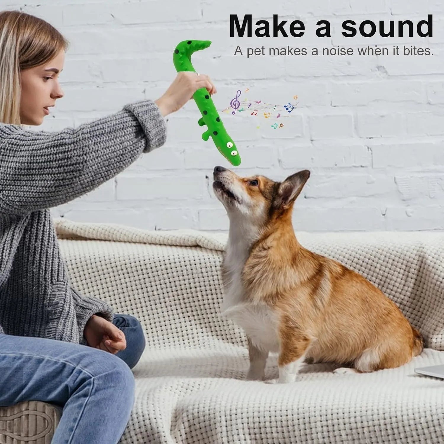 Green cartoon lizard-shaped dog chew toy with a squeaker on a white background.