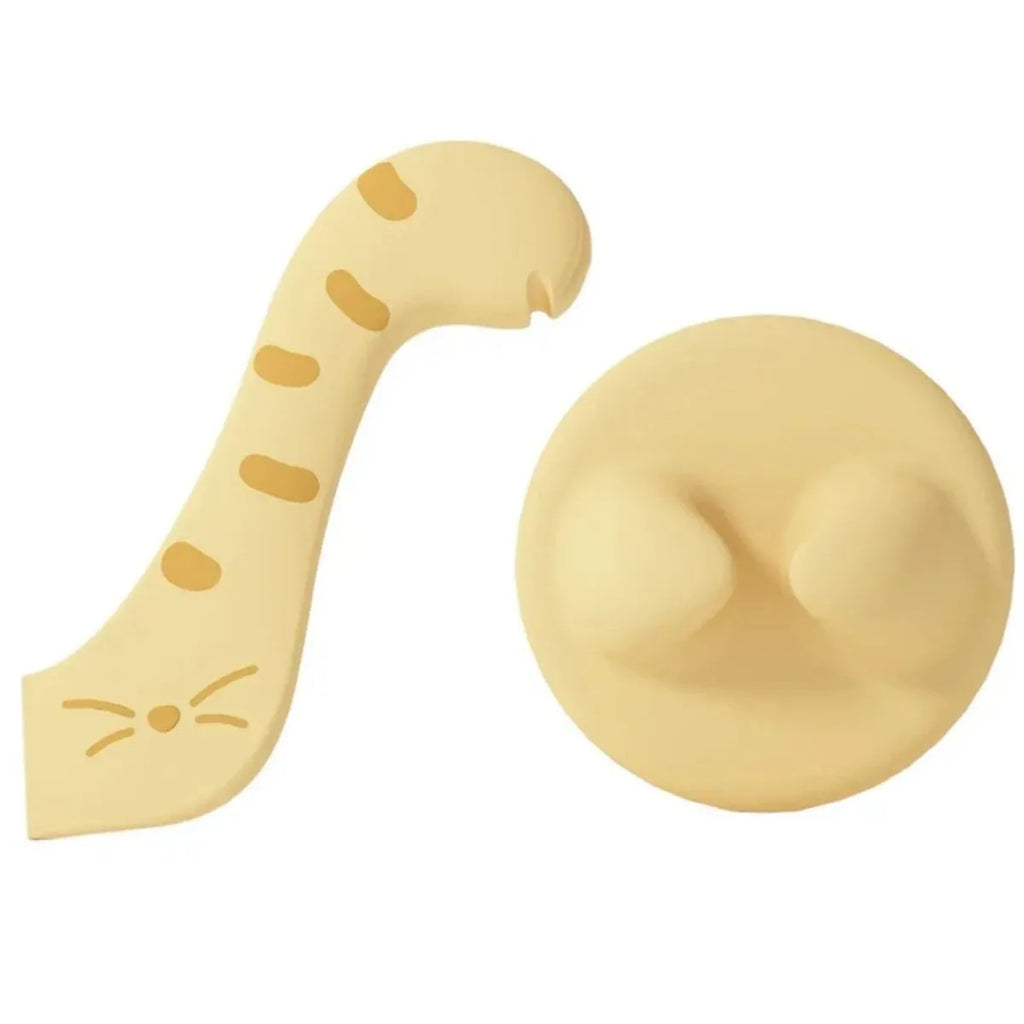 Grey silicone pet food spoon with integrated can opener and matching sealing lid for tins.