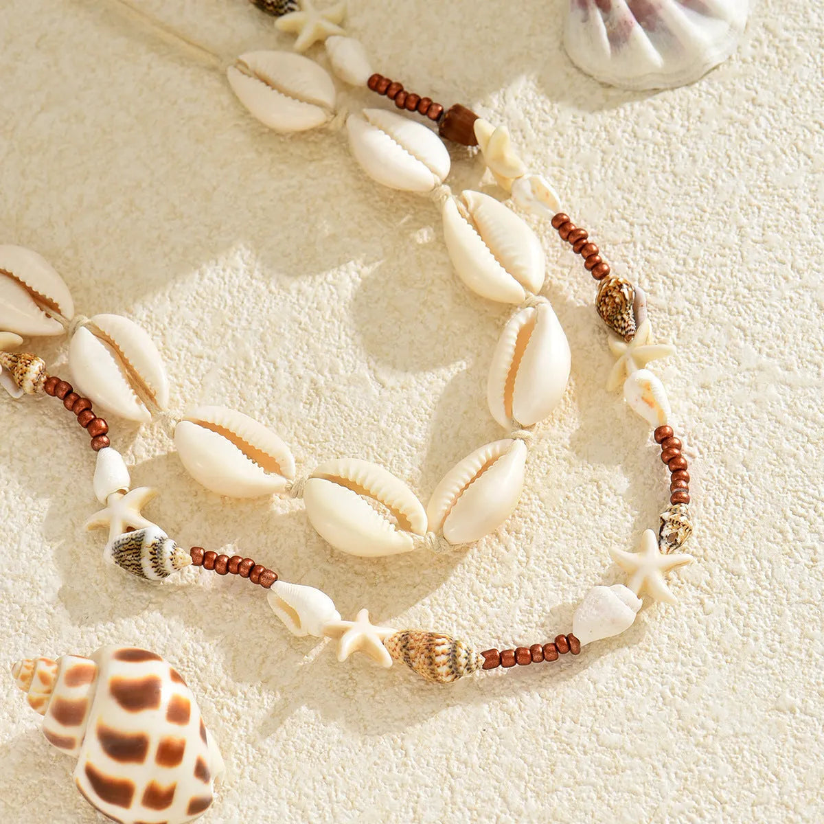 Handcrafted Bohemian shell necklace with geometric pendant on regular chain