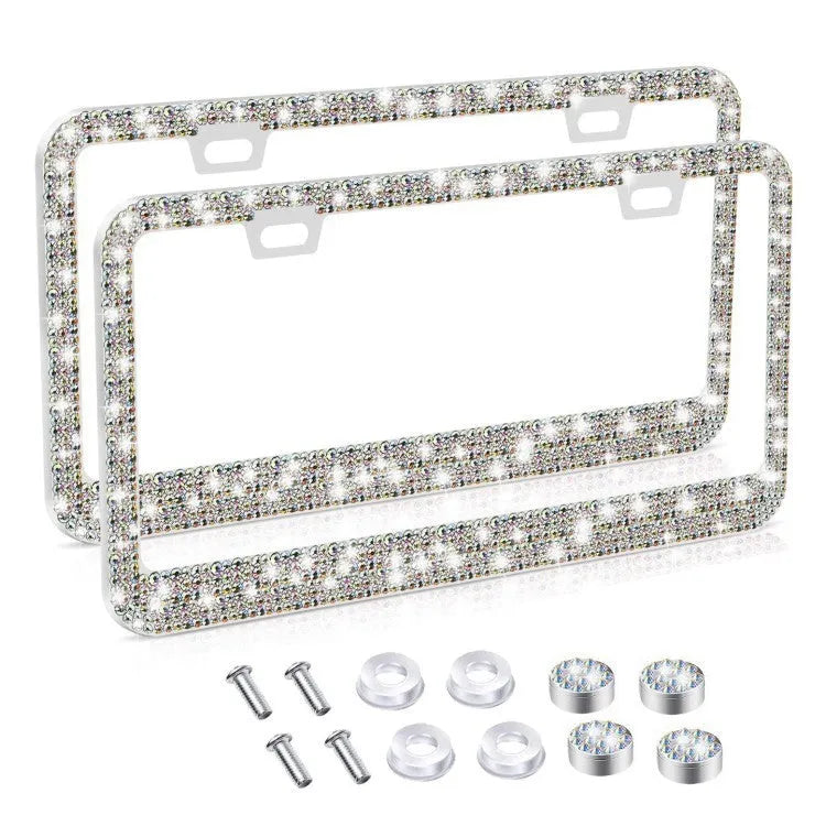 White diamond-studded stainless steel licence plate frame on a car showing 160x310mm external size