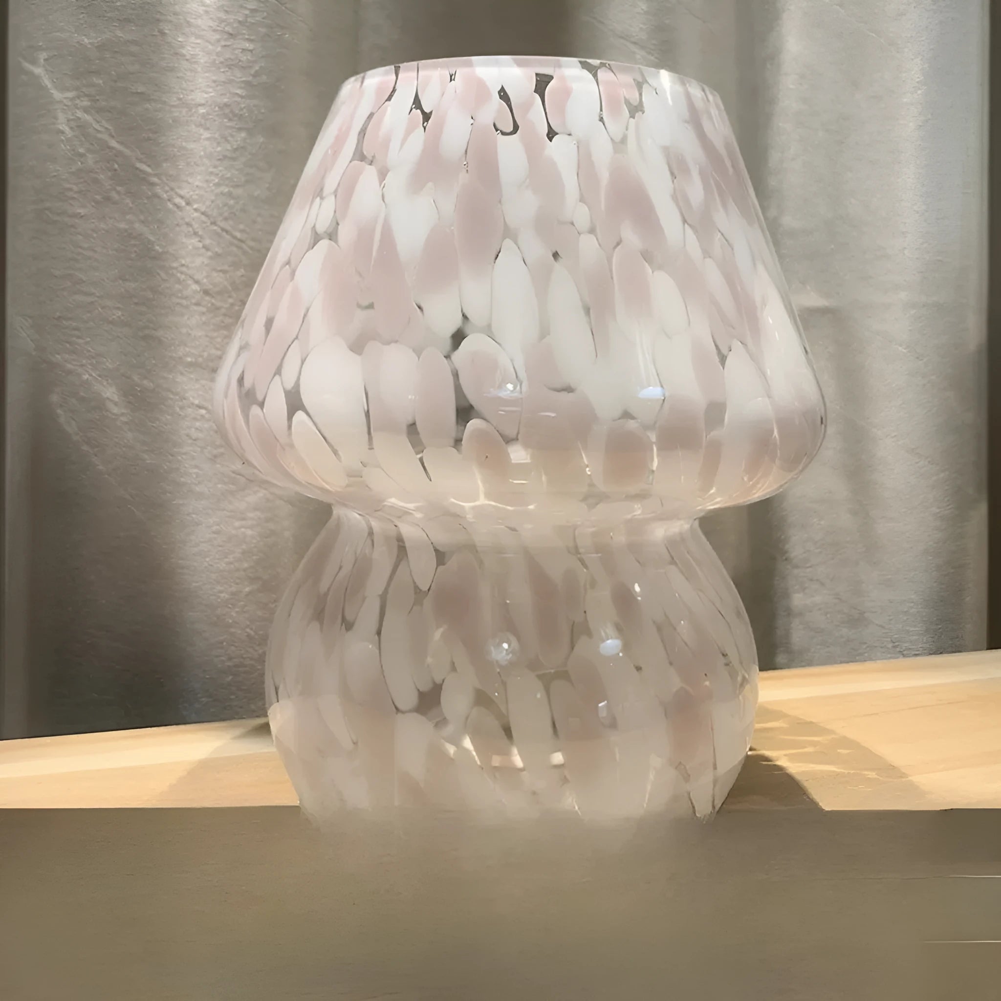 Flame mushroom pink and white glass mushroom table lamp with USB power and three-color light on a bedside table