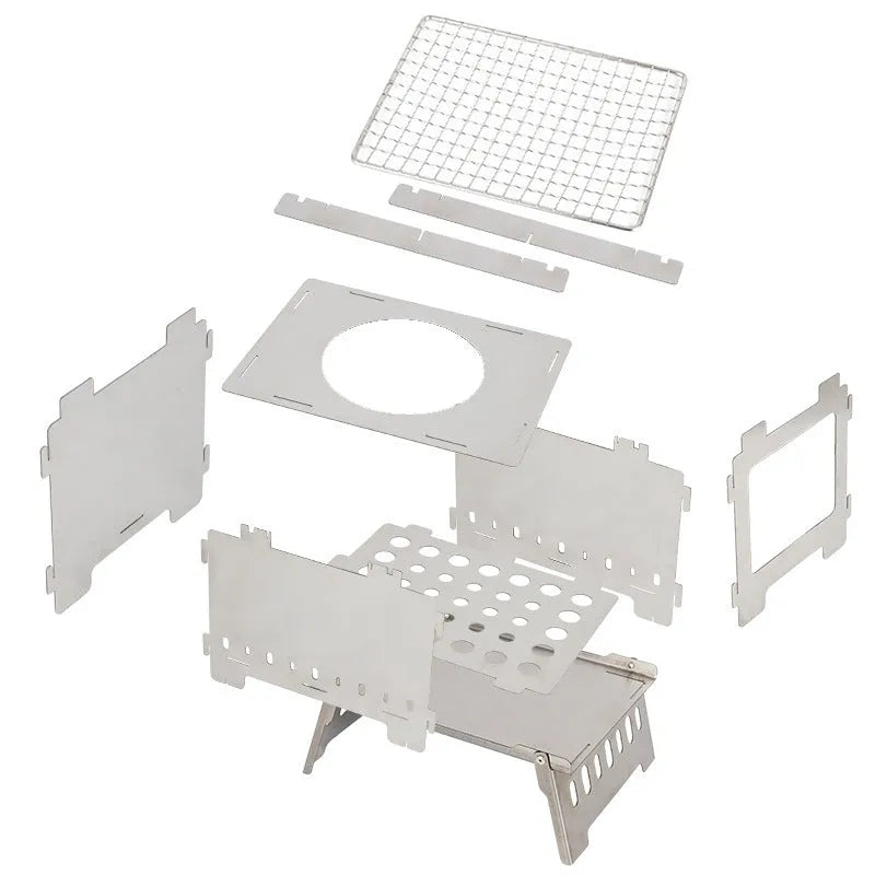 Silver outdoor folding card stove with grill mesh and storage bag on table