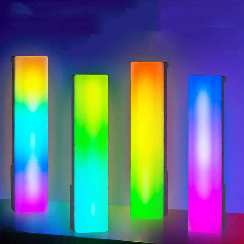 3D RGB voice-activated table lamp with colourful lights on a desk, showing white shell option.