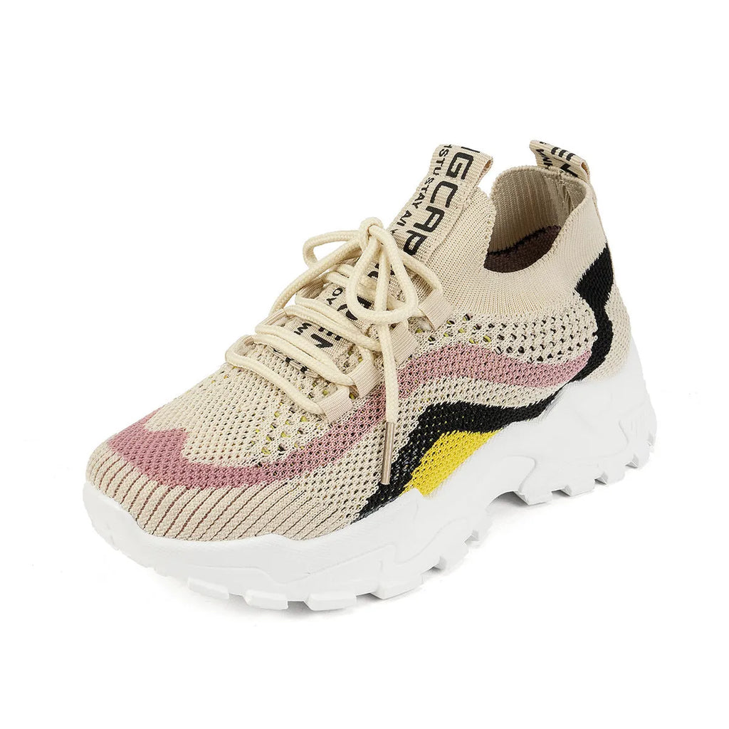 Women's casual sports shoes with mesh upper and lace-up front in black and white colour