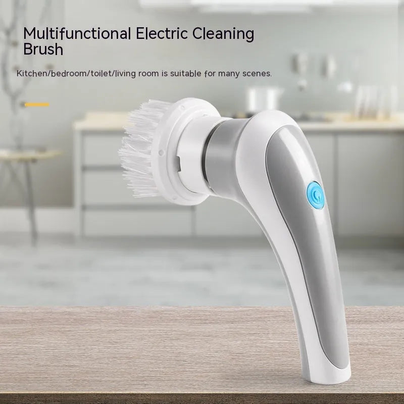 White handheld electric cleaning brush with rotating brush head on bathroom tiles