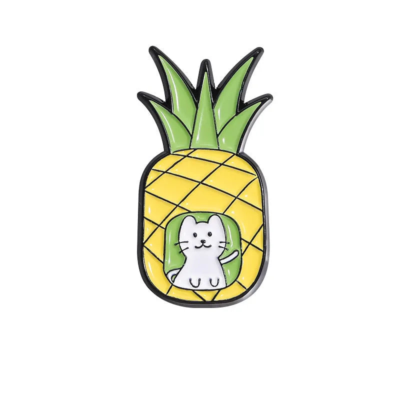 Colourful cartoon-style fruit metal brooch with pin clasp on a denim jacket lapel.