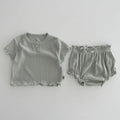 Cotton baby two-piece set with short sleeve top and shorts in light pink