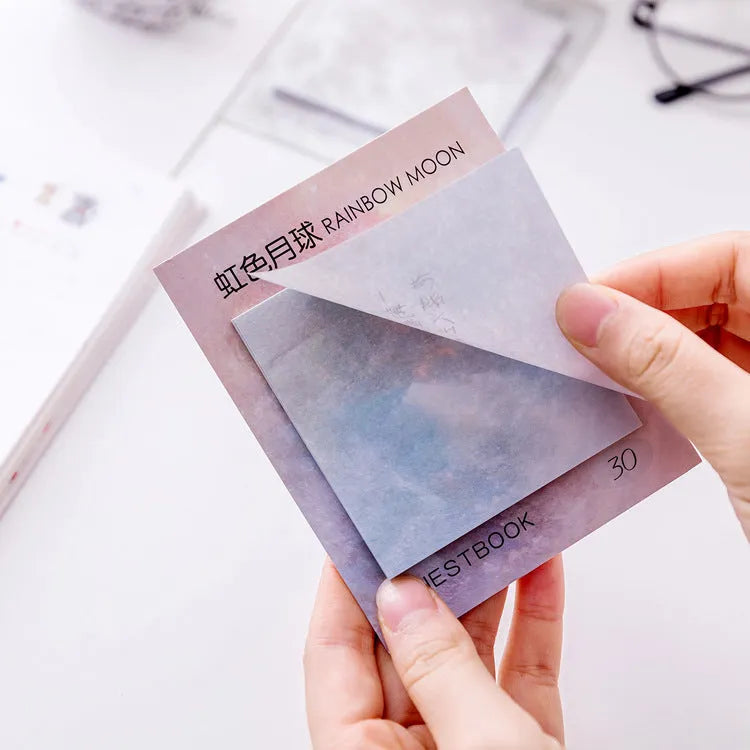 Square planet-themed sticky note pad showing 7.3cm size and oil painting designs of Moon and Earth.