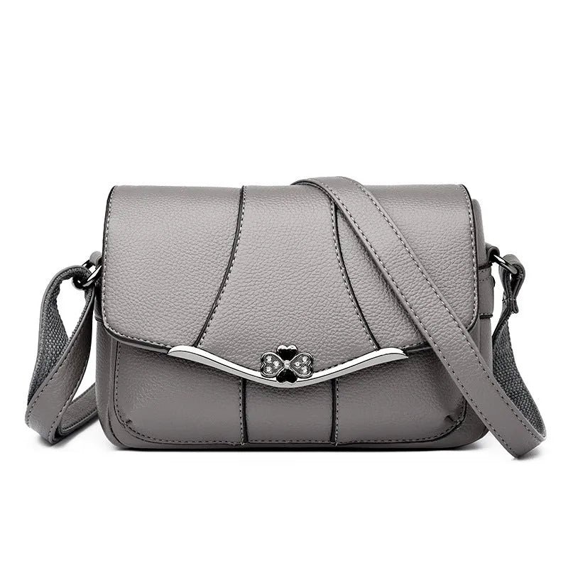 Round PU patchwork crossbody bag in beige with single shoulder strap and multiple internal pockets