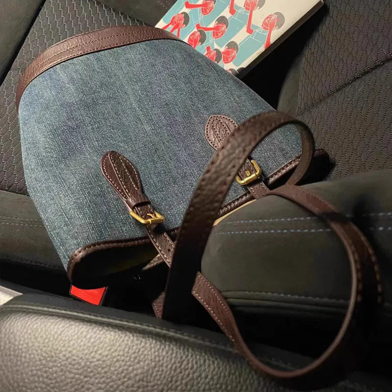Retro blue denim patchwork one-shoulder bucket bag with large capacity.