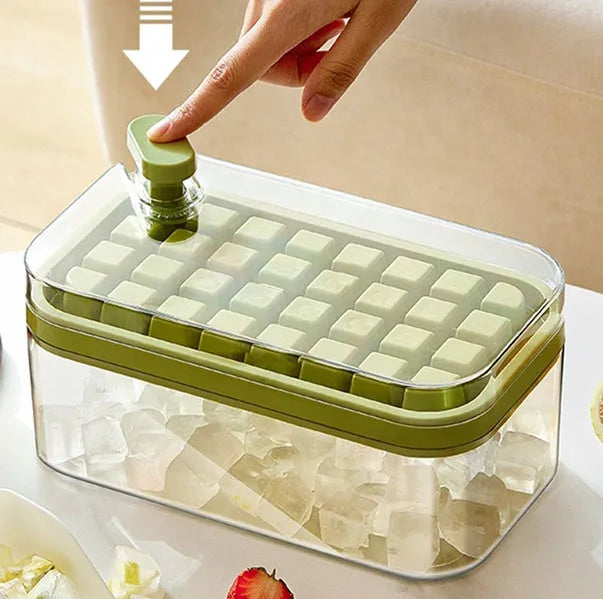 Green plastic ice cube tray with one-button release mechanism and a clear storage lid.