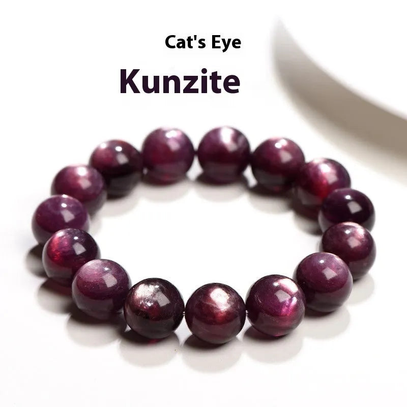 Purple lepidolite crystal round bead bracelet on a wrist, showing polished stones.