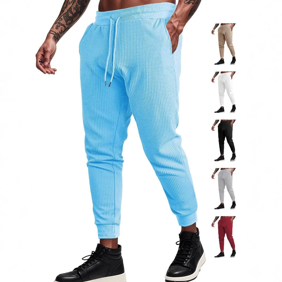 Men's casual loose solid colour waffle knit drawstring pants in khaki, front view, on white background