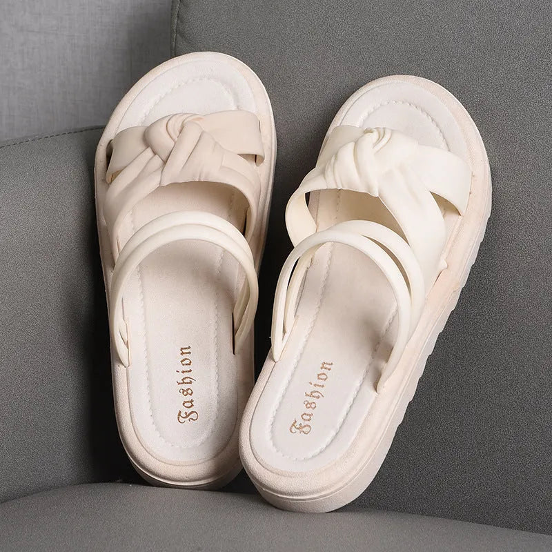 Women's black and white soft back outdoor sandals with flower detail and PVC sole