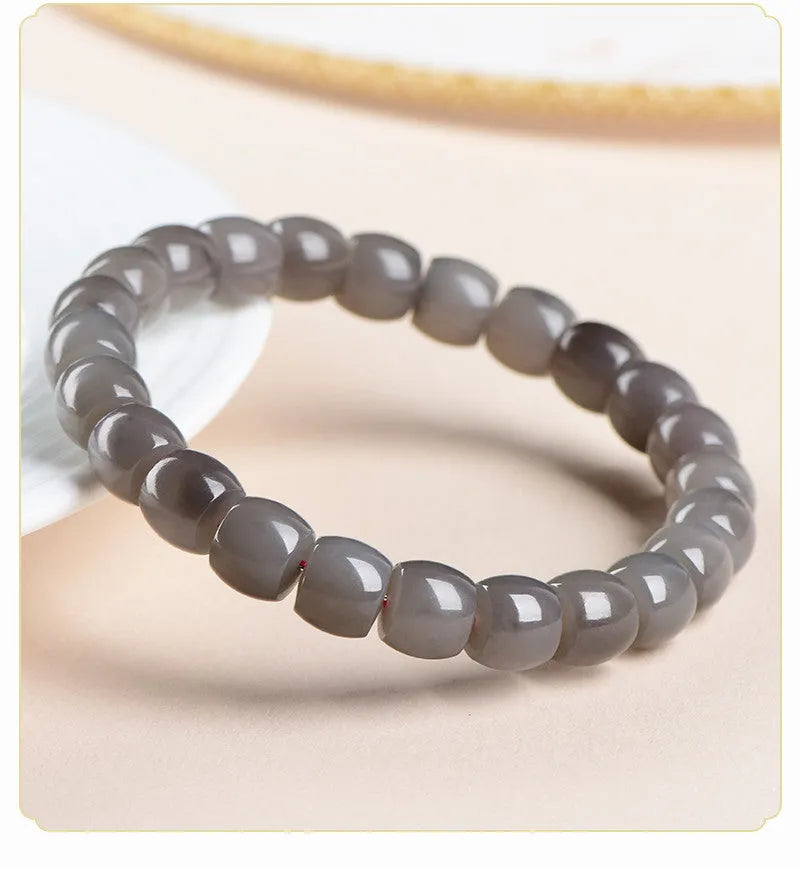 Straight cut smokey violet Hetian jade bracelet with approximately 24 beads, each measuring 8mm by 9mm.