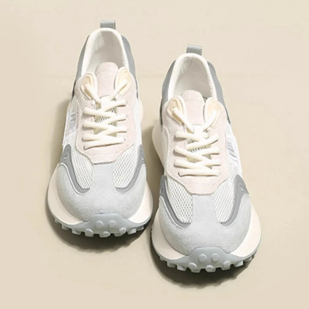 Women's grey and pink retro sneakers with low-top design and rubber soles