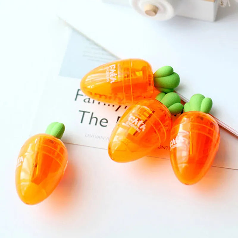 Carrot-shaped plastic pencil sharpener showing colourful design and 7cm length measurement