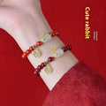 Cinnabar bracelet with jade hare charm and purple gold sand beads in retro style