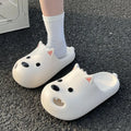Women's black and white EVA puppy slippers with protective toe cap design