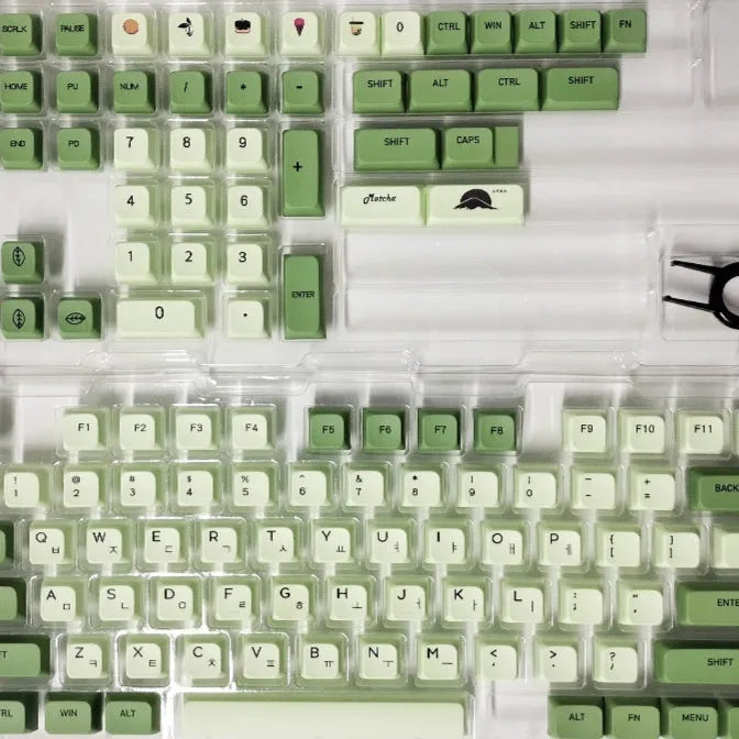 124-key matcha green PBT keycap set showing multiple international language layouts including Arabic and Korean.