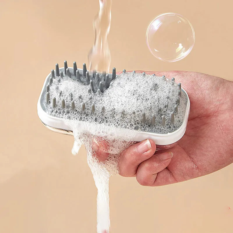 Silicone pet bath brush with soft bristles and ergonomic handle for dogs and cats