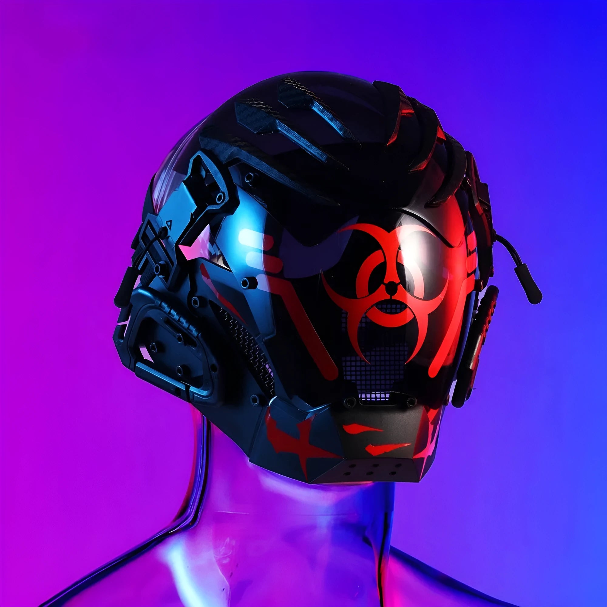 Black angular full-face tech helmet mask on a white background, showing sculpted details.