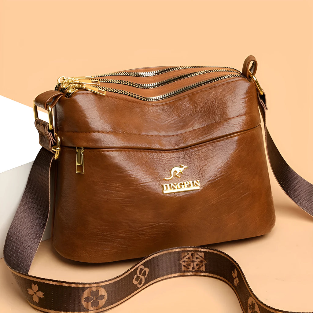 Brown PU leather cross body messenger bag with multiple compartments and sandwich pockets