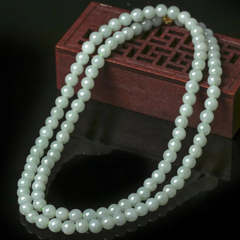 Natural A-level jade bead necklace with white and green round beads on an adjustable chain.