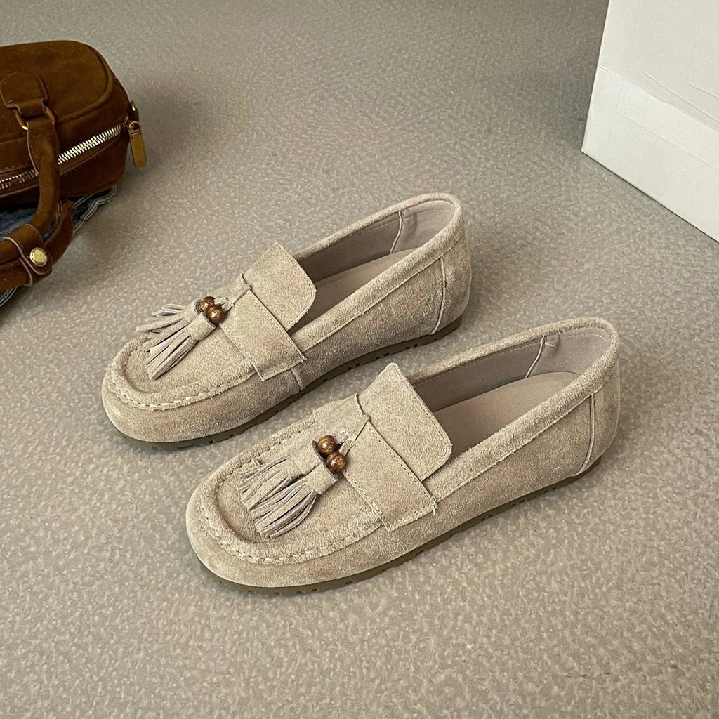 Women's inner height increasing slip-on tassel flats in brown with suede leather upper and round toe