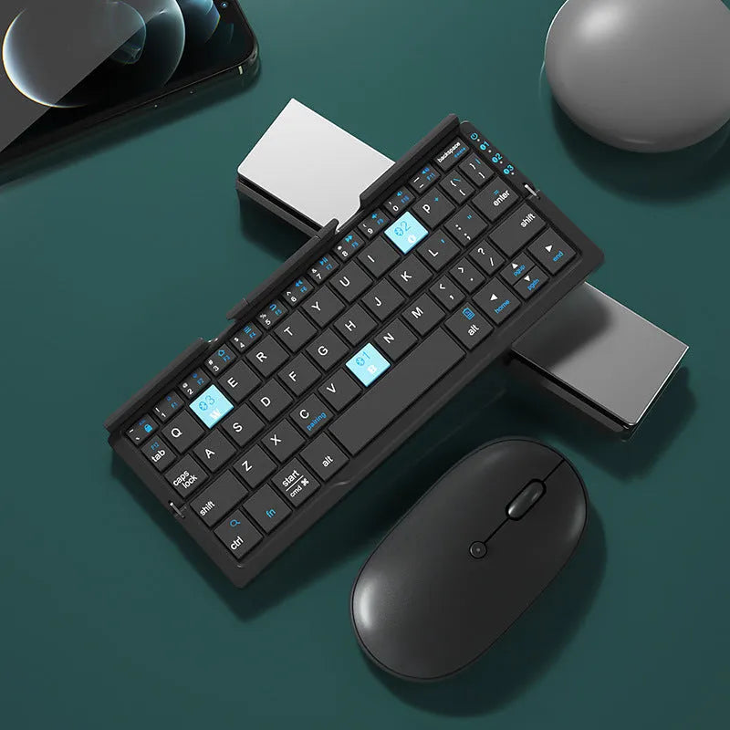 Silver aluminium folding Bluetooth keyboard shown open with phone on stand and folded to pocket size