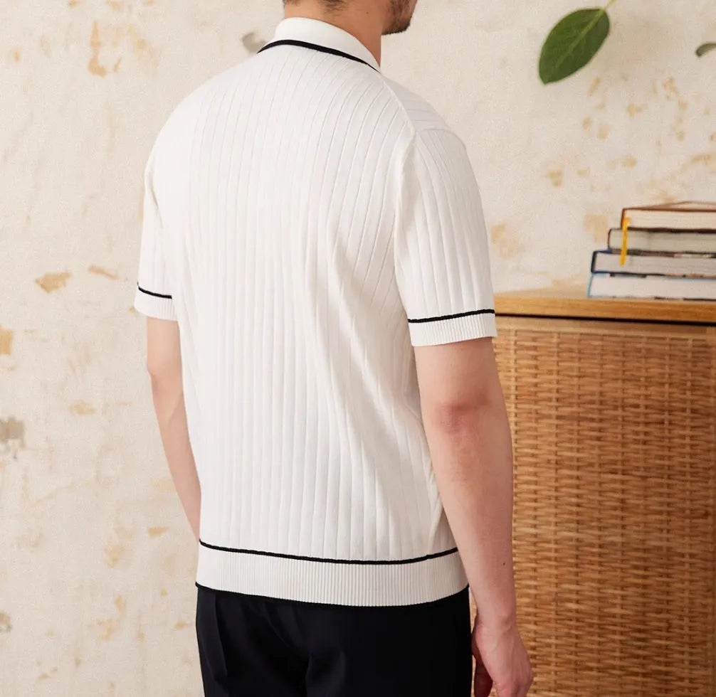 Slim black lapel collar knitted polo shirt with short sleeves on a mannequin.
