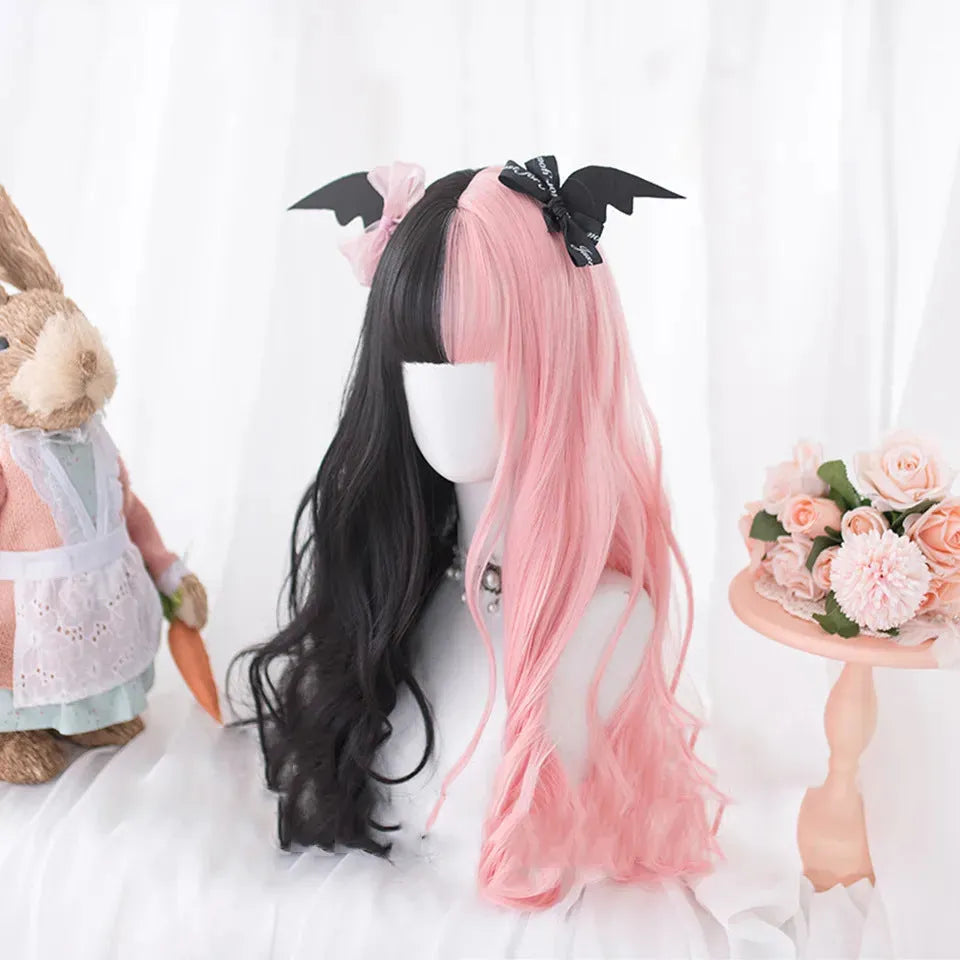 Long curly black and pink Lolita cosplay wig with a fringe on a display head.
