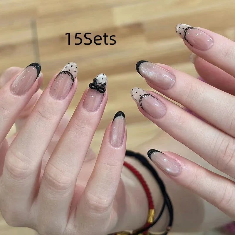 Sweet Girl Wearing Fake Nails set showing medium length coffin-shaped press-on nails with random colour designs.