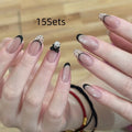 Sweet Girl Wearing Fake Nails set showing medium length coffin-shaped press-on nails with random colour designs.