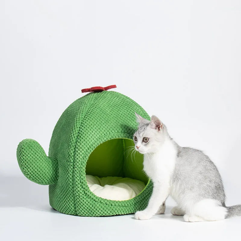 Green cactus-shaped enclosed cat bed tent with a plush cushion inside for kittens or small dogs.