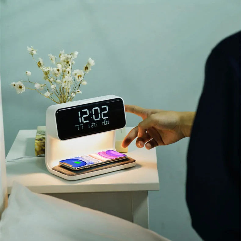 White bedside lamp with wireless charging pad and LCD clock display on base