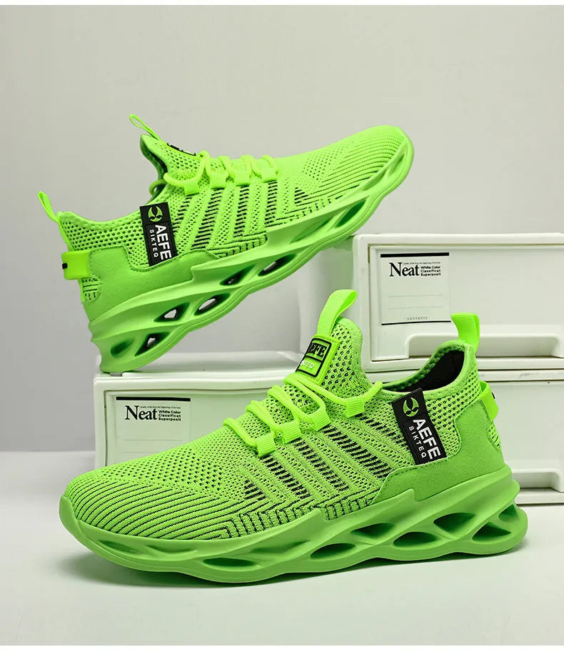 Men's black mesh casual running shoes with cross strap detailing and round toe, shown on a plain background.