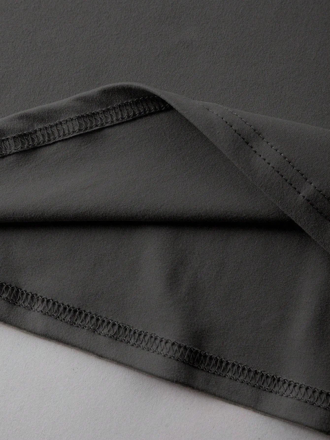 Straight cut loose summer t-shirt in cotton fabric on a hanger.