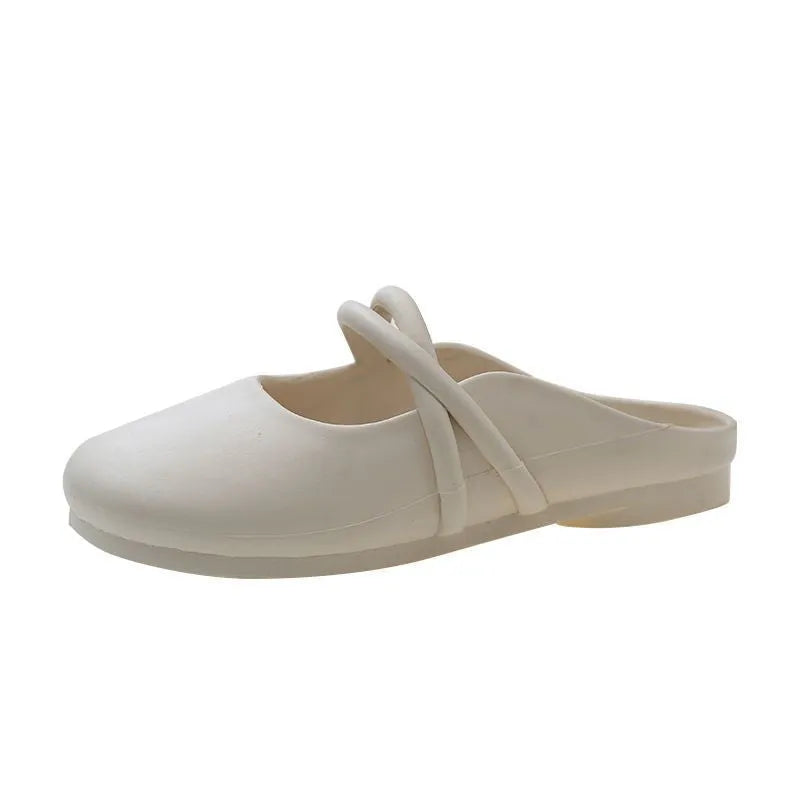 Ladies' plastic summer sandal with toe cap in green, shown from the side.