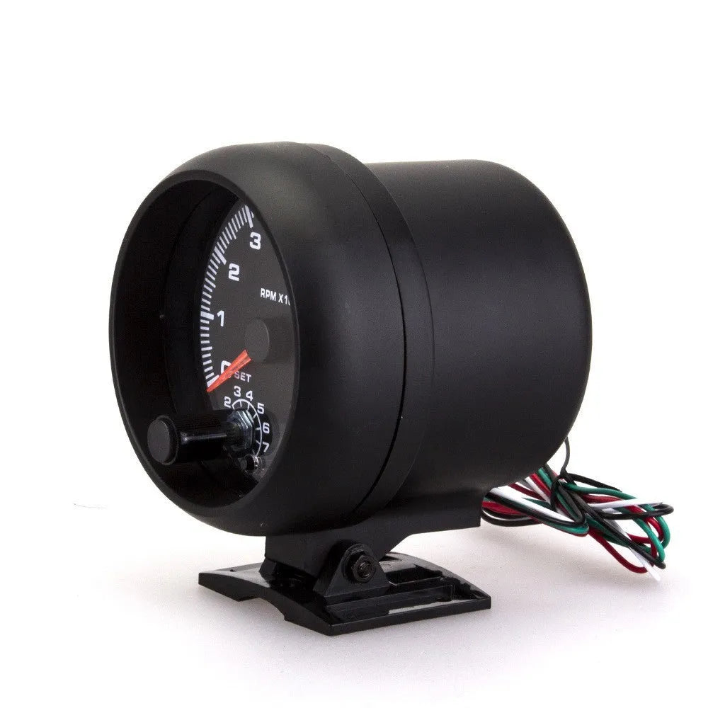 Black automotive tachometer with blue light pointer dial for measuring engine RPM.