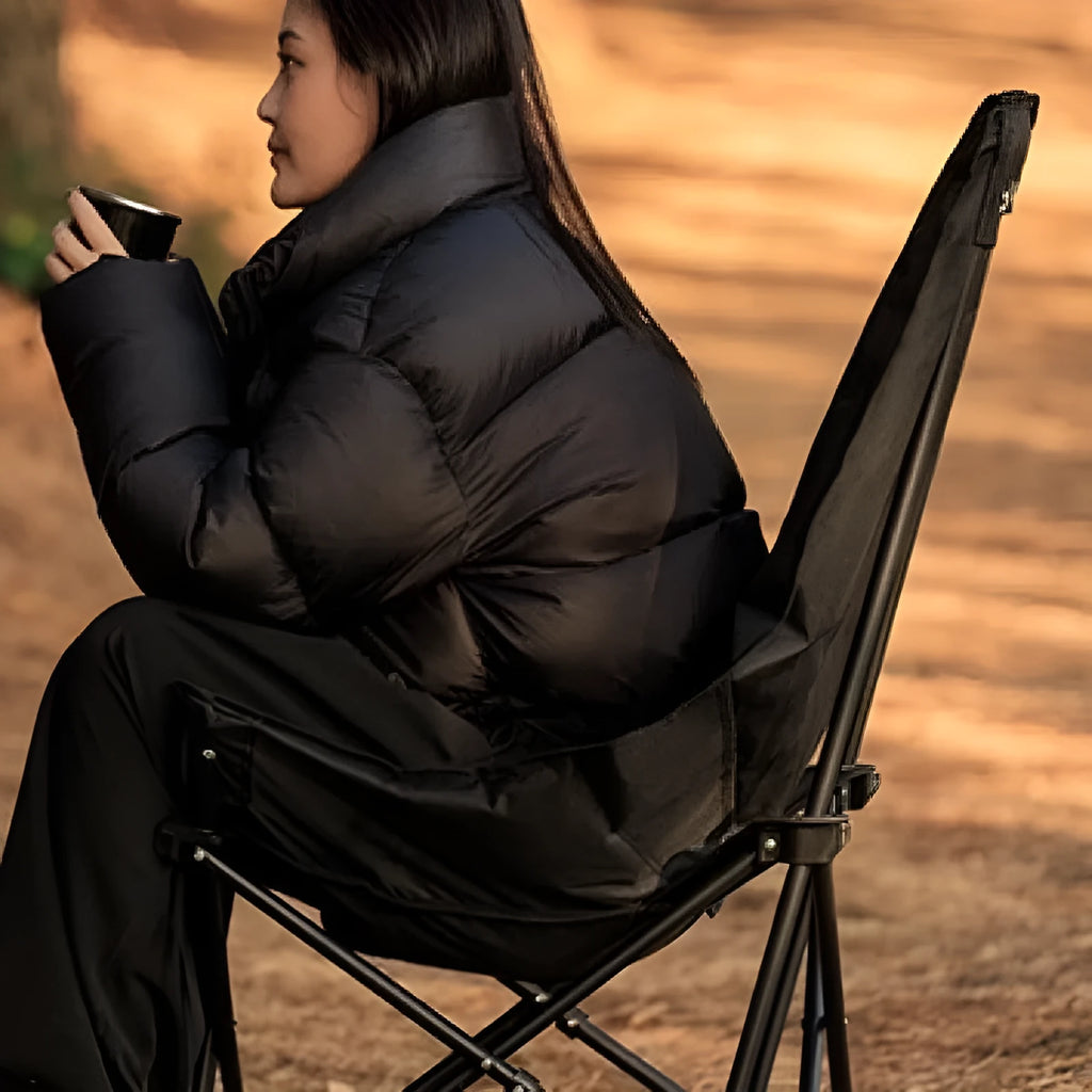 Night Black portable folding moon chair with Oxford cloth upholstery set up outdoors