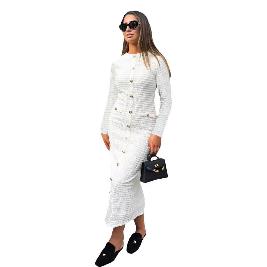 Women's slim fit black knitted long sleeve dress with button detail in French retro style.