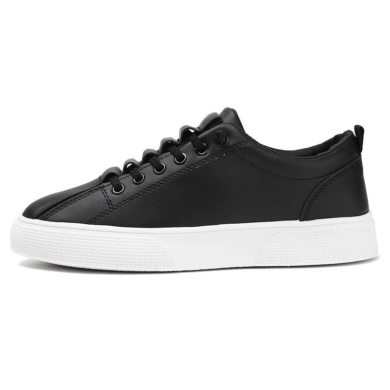 Men's black and white low top synthetic leather sports shoes with mesh panels and a PVC sole.